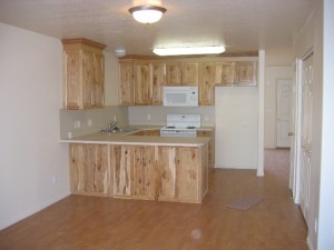 Kitchen with wood floors and light wood cabinets