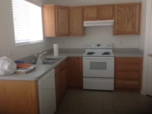 Kitchen with range, dishwasher and sink.