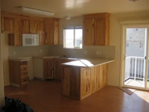 Kitchen with light wood cabinetry.